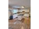 Bright kitchen with white cabinets, granite countertops, a central island, and modern appliances at 191 Lagrange Street, Grantville, GA 30220