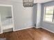 Dining room featuring hardwood floors and light blue walls at 305 Anderson Cir, Covington, GA 30016