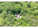 Aerial view of a private home surrounded by dense forest, offering tranquility and seclusion at 465 Willowbrook Dr, Smyrna, GA 30082