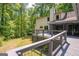 Back view of home with a large deck and private backyard at 465 Willowbrook Dr, Smyrna, GA 30082