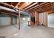Unfinished basement with concrete floor and exposed ceiling beams at 465 Willowbrook Dr, Smyrna, GA 30082
