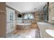 Bright bathroom features a soaking tub, double vanity, and separate shower with detailed tile work at 465 Willowbrook Dr, Smyrna, GA 30082