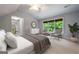 Bright bedroom boasts neutral walls, a large window, and a ceiling fan for a relaxing space at 465 Willowbrook Dr, Smyrna, GA 30082