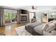 Spacious main bedroom suite boasting a stone fireplace, hardwood floors and ensuite bathroom at 465 Willowbrook Dr, Smyrna, GA 30082
