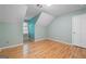 Bedroom with hardwood floors, a window, an electrical outlet, and light blue walls at 465 Willowbrook Dr, Smyrna, GA 30082