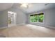Carpeted bedroom with large windows, ceiling fan, and an open doorway, offering ample space at 465 Willowbrook Dr, Smyrna, GA 30082