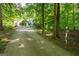 View of the long driveway leading to the home with a mailbox and home number at 465 Willowbrook Dr, Smyrna, GA 30082