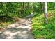 Long driveway lined with mature trees leads to the house at 465 Willowbrook Dr, Smyrna, GA 30082