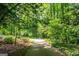 Long driveway lined with mature trees leads to this peaceful home at 465 Willowbrook Dr, Smyrna, GA 30082