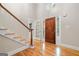 Inviting foyer features hardwood floors, stairs, and a beautiful front door with decorative sidelights at 465 Willowbrook Dr, Smyrna, GA 30082