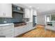 Modern kitchen with stainless steel appliances, sleek cabinetry, and hardwood floors at 465 Willowbrook Dr, Smyrna, GA 30082