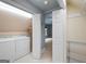 Functional laundry room featuring a washer, dryer, and access to a closet and another room at 465 Willowbrook Dr, Smyrna, GA 30082