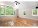 Spacious living room with hardwood floors, cathedral ceiling, and large windows overlooking the backyard at 465 Willowbrook Dr, Smyrna, GA 30082