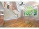 Open living room with vaulted ceiling, hardwood floors, and a staircase leading to a loft at 465 Willowbrook Dr, Smyrna, GA 30082