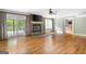 Cozy living room with stone fireplace, hardwood floors, and access to an outdoor deck at 465 Willowbrook Dr, Smyrna, GA 30082