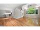 Open-concept living room with hardwood floors, large windows, and a view into the kitchen at 465 Willowbrook Dr, Smyrna, GA 30082
