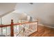 View from a loft with hardwood floors, looking over a staircase and into the main living area at 465 Willowbrook Dr, Smyrna, GA 30082