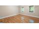 Empty room with hardwood floors, and natural light, providing a versatile space at 465 Willowbrook Dr, Smyrna, GA 30082