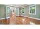 Spacious room featuring hardwood floors, large windows, and elegant French doors at 465 Willowbrook Dr, Smyrna, GA 30082
