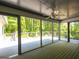 Interior of the screened-in porch features wood flooring and a ceiling fan at 465 Willowbrook Dr, Smyrna, GA 30082