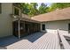Exterior view of the screened in porch shows the deck and entrance to the home at 465 Willowbrook Dr, Smyrna, GA 30082