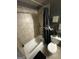 Bathroom features a shower, tile flooring, and modern fixtures at 7644 Wrotham Cir, South Fulton, GA 30349