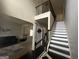 Spacious foyer with a grand staircase, neutral paint, and modern decorations, offering an inviting entrance at 7644 Wrotham Cir, South Fulton, GA 30349