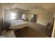 Spacious main bedroom with tray ceiling, sitting area, and lots of natural light at 7644 Wrotham Cir, South Fulton, GA 30349