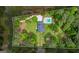 Aerial view of estate on large lot with pool, framed by mature trees and lush landscaping, offering privacy at 171 Ponderosa Drive, Fayetteville, GA 30214