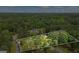 Overview of a tree-lined property with a defined boundary, highlighting the home's setting and outdoor amenities at 171 Ponderosa Drive, Fayetteville, GA 30214