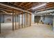 Unfinished basement featuring concrete floors, exposed ceiling, and frame wall at 171 Ponderosa Drive, Fayetteville, GA 30214
