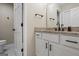 Bathroom with white cabinets, granite countertop, and sleek black hardware at 171 Ponderosa Drive, Fayetteville, GA 30214