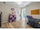 bedroom featuring playful decor and laminate wood flooring at 171 Ponderosa Drive, Fayetteville, GA 30214