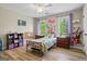 ' bedroom featuring laminate wood floors and bright natural light at 171 Ponderosa Drive, Fayetteville, GA 30214
