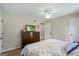 Relaxing bedroom featuring a ceiling fan, dresser, and two closets, all with warm neutral tones at 171 Ponderosa Drive, Fayetteville, GA 30214
