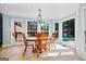 Charming dining area featuring a wood table, chandelier, and large windows with bright natural light at 171 Ponderosa Drive, Fayetteville, GA 30214