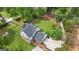 Exterior elevation of white and brick two-story home with a well-manicured lawn, mature trees and a spacious driveway at 171 Ponderosa Drive, Fayetteville, GA 30214