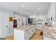 Beautiful kitchen with white cabinets, granite countertops, stainless steel appliances, and a large island at 171 Ponderosa Drive, Fayetteville, GA 30214