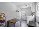Well-lit laundry room with tile floor, hanging rack, washer, and dryer hookups at 171 Ponderosa Drive, Fayetteville, GA 30214
