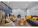 Inviting living room featuring hardwood floors, stylish furniture, decorative accents, and natural light from shuttered windows at 171 Ponderosa Drive, Fayetteville, GA 30214