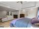 Spacious bedroom with connected sitting area, hardwood floors, and ensuite bathroom at 171 Ponderosa Drive, Fayetteville, GA 30214
