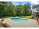 Refreshing in-ground pool surrounded by concrete patio, with a backyard gazebo, and lush greenery at 171 Ponderosa Drive, Fayetteville, GA 30214