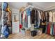 Walk-in closet with built-in shelving, lots of storage, and light-colored floors at 171 Ponderosa Drive, Fayetteville, GA 30214