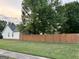 Well-manicured backyard with a wood fence at 486 Village Cir, Stockbridge, GA 30281