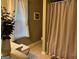 Bathroom featuring shower and window with natural light at 486 Village Cir, Stockbridge, GA 30281