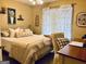Comfortable bedroom with a cozy bed, soft pillows, and a bright window with patterned curtains at 486 Village Cir, Stockbridge, GA 30281