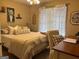 Bedroom featuring bed, desk, and window with natural light at 486 Village Cir, Stockbridge, GA 30281