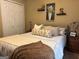 Bright bedroom featuring a queen bed, soft neutral color palette, and modern décor at 486 Village Cir, Stockbridge, GA 30281