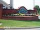 Community entrance featuring manicured landscape with a brick sign at 486 Village Cir, Stockbridge, GA 30281