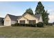 Charming one-story home with a well-manicured lawn and attached garage at 486 Village Cir, Stockbridge, GA 30281